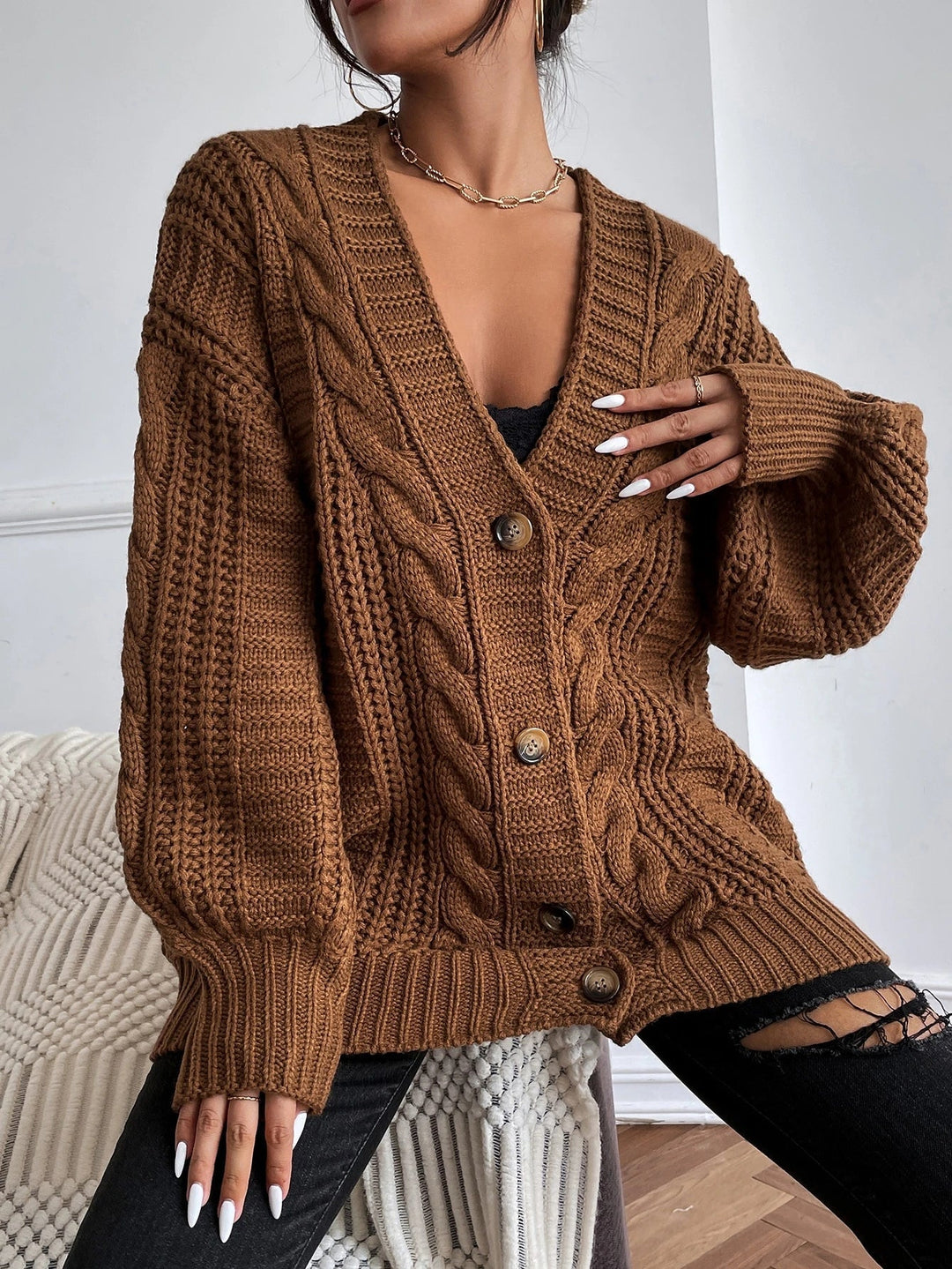 Übergrosse Kabelstrick-Strickjacke