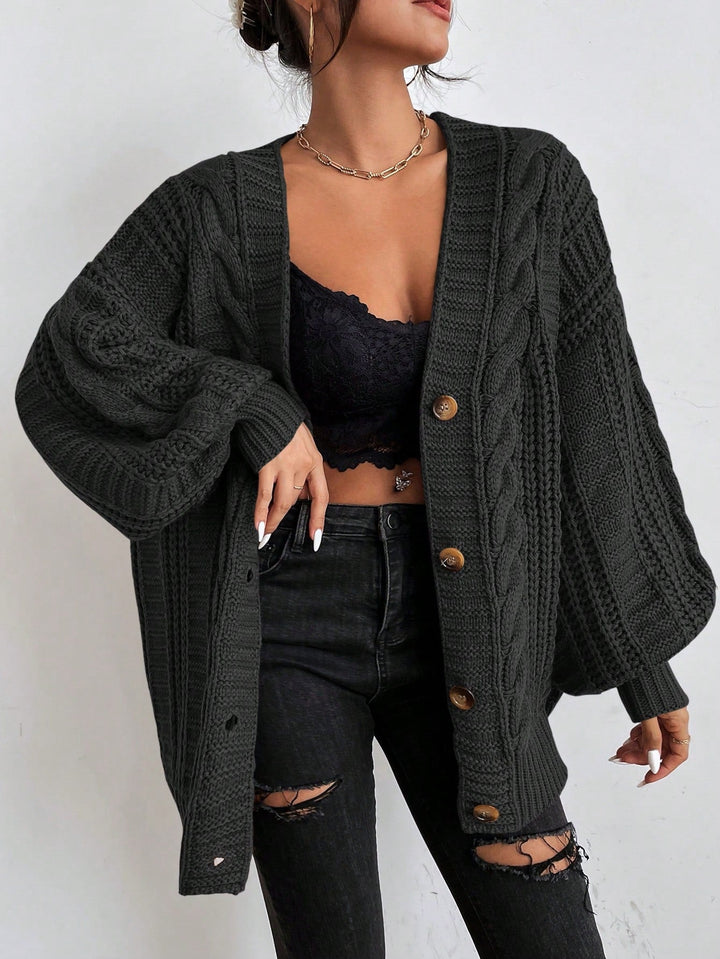 Übergrosse Kabelstrick-Strickjacke